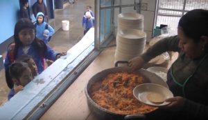 Children being served Tactic Tacos