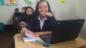 smiling student learning with computers